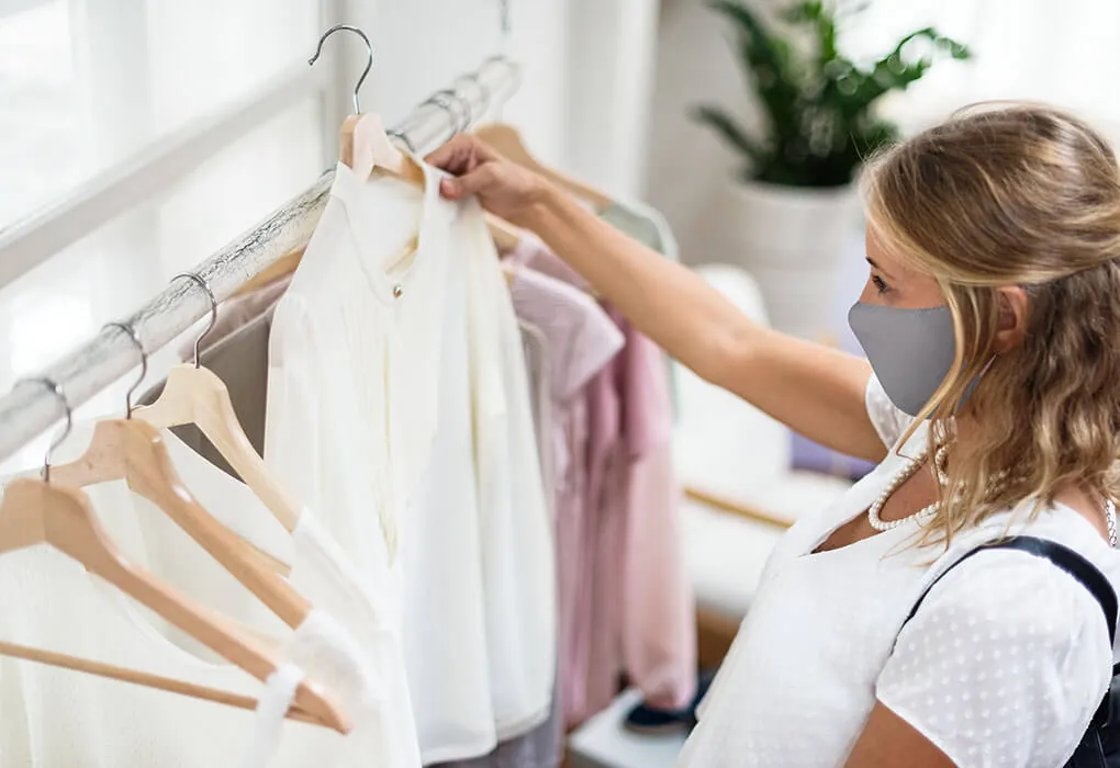 Customer care team member preparing clothing orders
