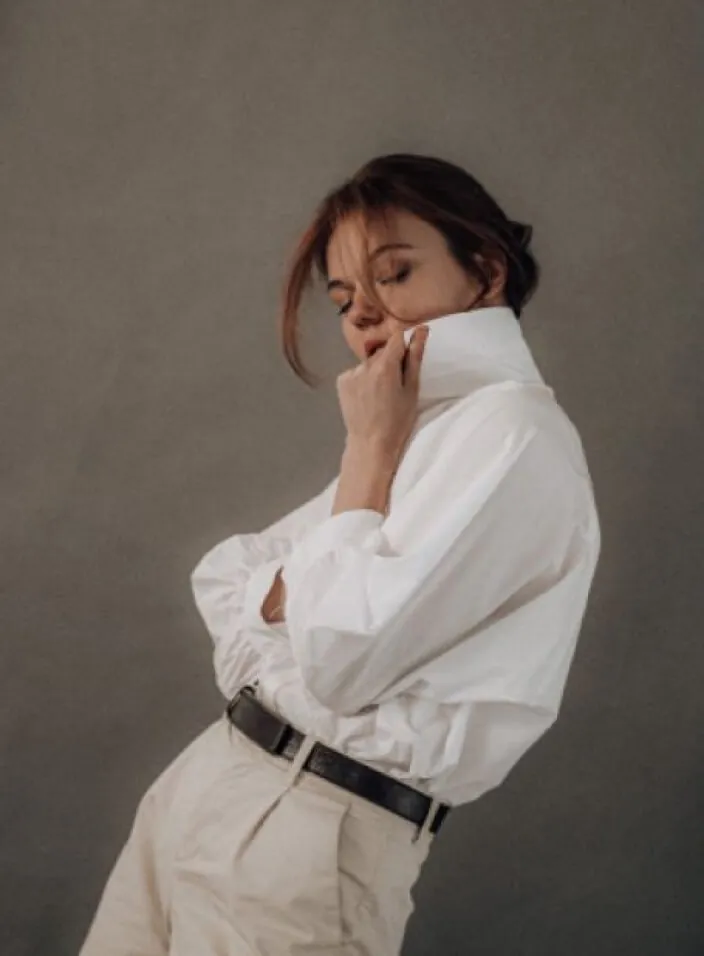 Smiling woman in a white shirt