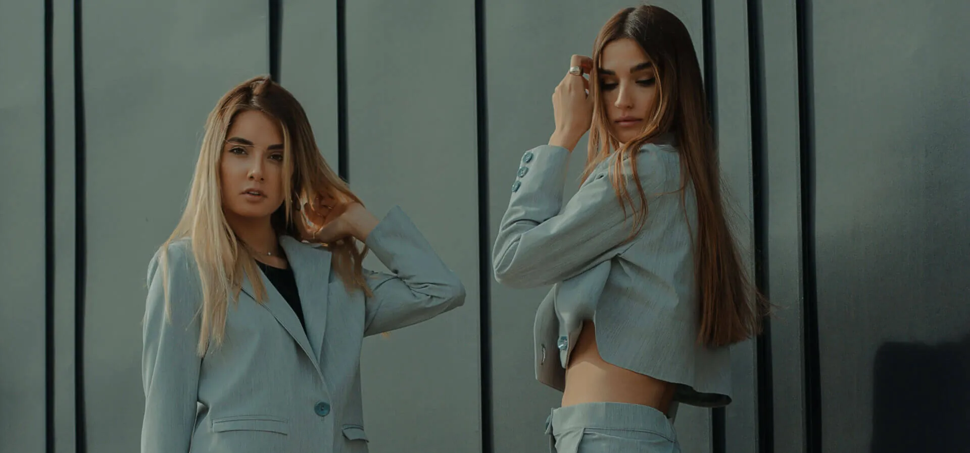 Two women in stylish pastel blazers
